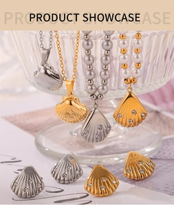 Detail of diamond-encrusted shell pendants with freshwater pearl necklaces and steel chains