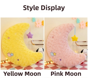 Detail of rose-textured plush moon pillows in pink and yellow with star embroidery