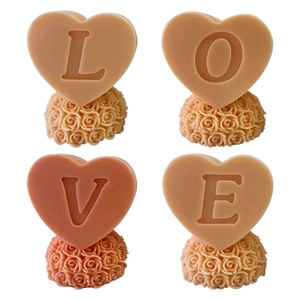 Detailed view of LOVE letters on heart-shaped candle molds with rose bases for DIY gifts