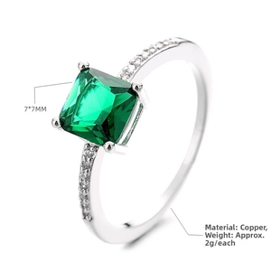 Detail view of 7x7mm emerald cut green zircon ring with sparkling side stones