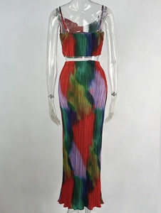 Close-up of pleated fabric texture and colorful gradient pattern on two-piece set