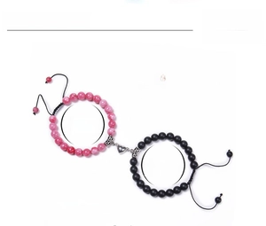 Detailed view of magnetic heart clasp with 8mm pink crystal and black matte beads