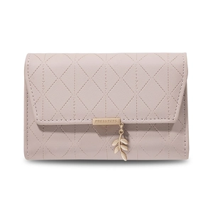 Detail of light pink PU leather wallet with diamond lattice stitching and leaf pendant