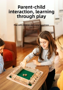 Close-up of 4-way wooden Shut the Box game with green felt and number tiles