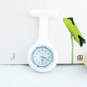Detail of white silicone nurse watch featuring a round dial with red medical cross icon