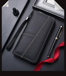 Detailed view of long leather wallet with white stitching and textured finish