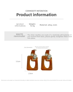 Detail showing amber resin rectangular hoop earrings with dimensions 5.5cm x 2.9cm