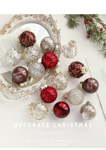 Detailed close-up of textured Christmas balls with glitter and star patterns on festive table
