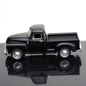 Side view of a vintage black alloy pickup truck model with realistic metal details