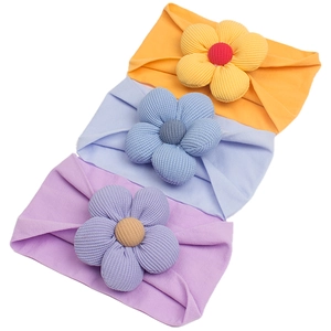 Three-pack of soft nylon baby headbands with large textured 3D floral accents