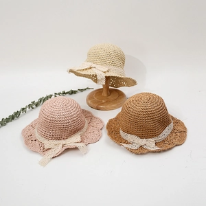 Three colors of handmade baby straw hats with elegant lace bows for summer sun protection