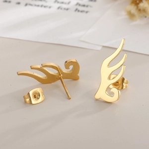 Detailed close-up of golden flame-shaped titanium steel studs with butterfly backs