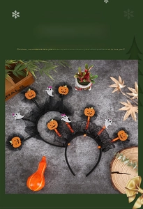 Detail of Halloween headbands with sequined pumpkins, ghosts and black mesh lace trim