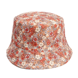 Floral reversible bucket hat with orange flower patterns for sun protection