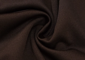 Detailed close-up of dark brown knitted fabric with spiral pleats and fine texture