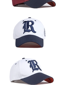 Detail of color-block baseball cap with vintage R embroidery and orange brim bottom
