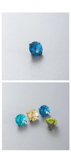 Macro shot of colorful zircon studs with threaded F136 titanium base for piercings