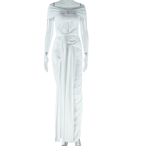 Detail of white satin dress featuring off-shoulder neckline and elegant waist draping