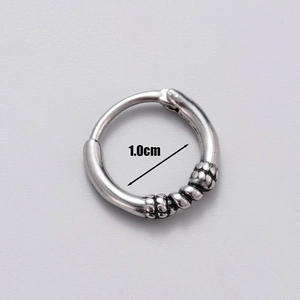 Macro shot of 1.0cm inner diameter on vintage silver stainless steel men's hoop earring
