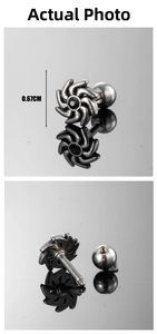 Macro detail of men's stainless steel turbine earring with a black stone and screw back
