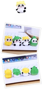 Set of four cute panda figurines with yellow hats and bamboo shoots for desk or car