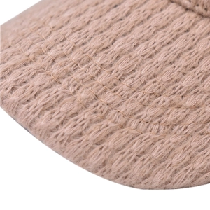 Winter plaid baseball cap with warm fleece lining in brown knitted texture view