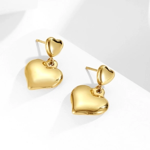 Minimalist gold heart dangle earrings for women featuring a polished metallic finish