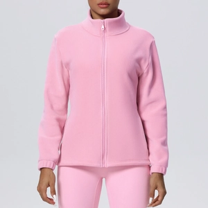 Close-up detail of pink fleece jacket with stand collar and zipper closure for women