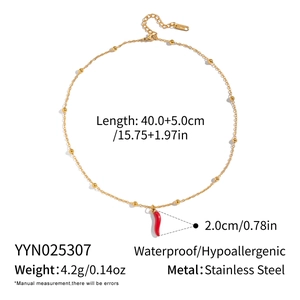 Macro view of 18K gold stainless steel necklace with red chili pendant and dimensions
