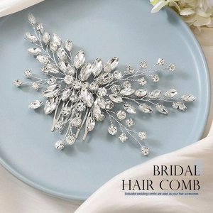 Exquisite bridal hair comb with silver crystals in floral leaf design on a blue tray