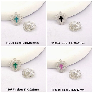 Detail of 20mm alloy heart pendants with lace edges and colorful enamel crosses