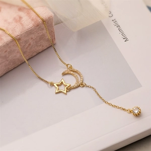 Gold-plated necklace with hollow star and zircon moon pendant on jewelry box