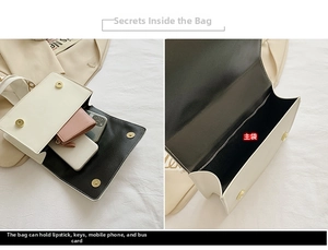 Internal view of white crossbody bag showing storage space for phone and wallet
