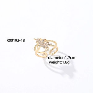 Detailed view of golden unicorn open ring with clear zircon crystals and size parameters