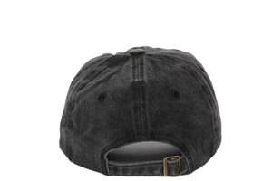Detail view of adjustable metal buckle and vintage washed fabric on the baseball cap