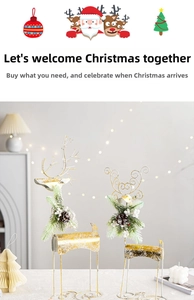 Detail of metal wire Christmas reindeer set with pine cones and berries decoration