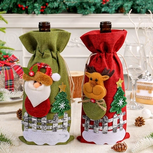 Festive burlap Christmas wine bottle covers featuring Santa and Reindeer appliques