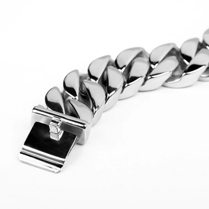 Detailed macro view of silver titanium steel Cuban link bracelet with a secure clasp