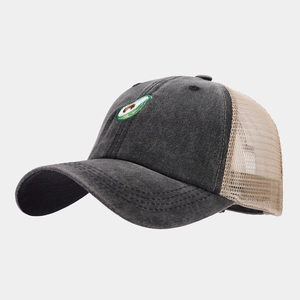 Side view of mesh trucker hat featuring avocado embroidery and breathable gray fabric