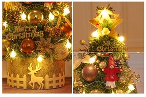 Detail view of 60cm mini Christmas tree with gold ornaments, stars and warm LED lights