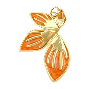 Close-up of orange gradient leaf pendant with gold edges and small metal jump ring