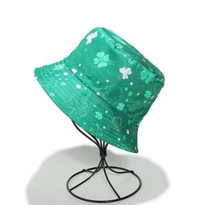 Close-up detail of green St. Patrick's Day bucket hat with white clover print