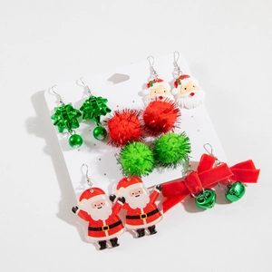 Detail view of 6-pair Christmas earring set with Santa, bells and colorful pom-poms