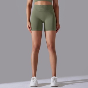 Detail view of high-waist seamless olive green sports shorts in elastic knit fabric