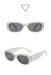 Close-up of retro rectangle sunglasses with light brown frames and dark grey lenses