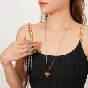 Elegant beaded heart necklace featuring natural tiger eye stone and polished silver chain