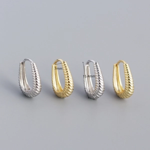 Detailed view of S925 sterling silver twist hoop earrings in gold and silver finish