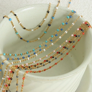 Colorful beaded gold chains in multi-color enamel drops for elegant jewelry styling