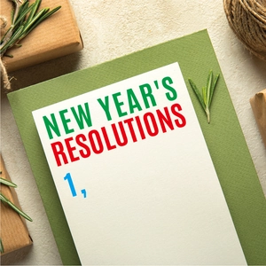New Year's Resolution cards and sage green envelope on a textured background