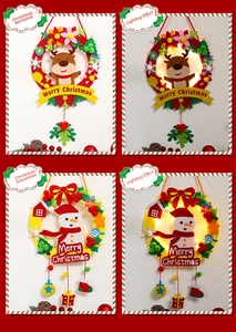 Detail of DIY Christmas felt wreaths with LED lights showing deer and snowman styles